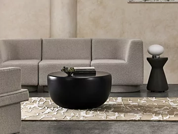 Blinde Design Node 30 concrete coffee table with matching Solo stools enriches a graphite-toned private living room indoors.