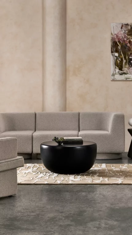 Blinde Design Node 30 concrete coffee table with matching Solo stools enriches a graphite-toned private living room indoors.